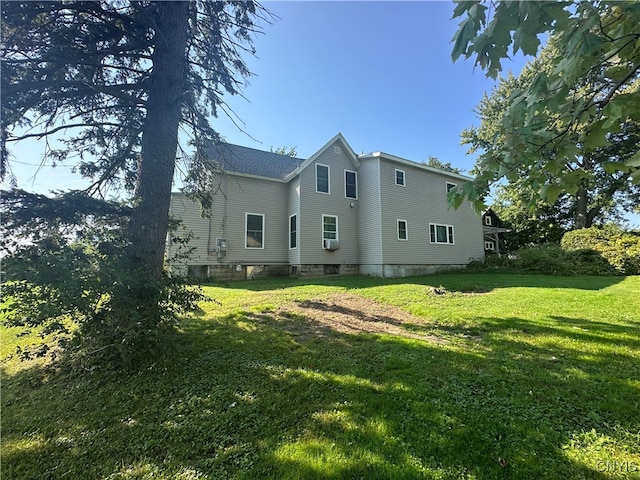 back of house with a yard