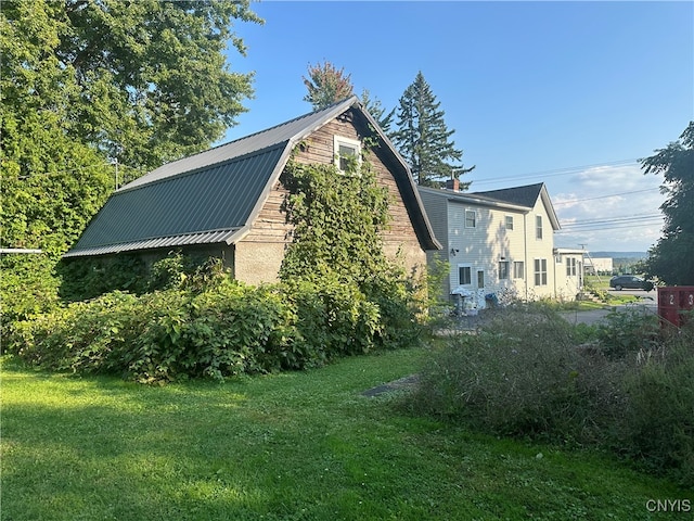 view of property exterior with a yard