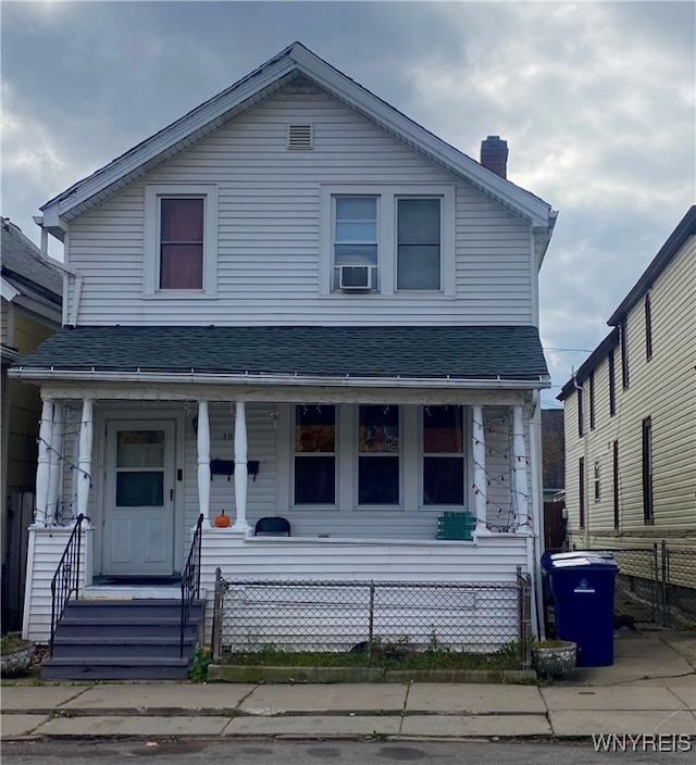 view of front of home featuring a porch and cooling unit