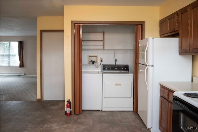 clothes washing area featuring independent washer and dryer and a baseboard radiator