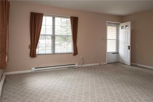 carpeted empty room featuring a baseboard radiator