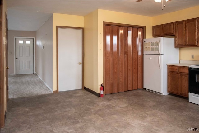 kitchen with white appliances and ceiling fan