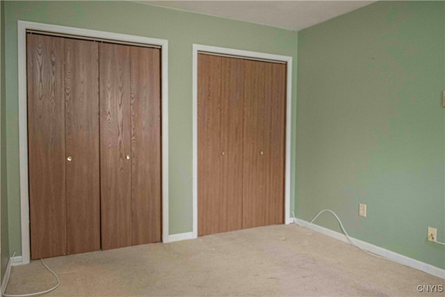 unfurnished bedroom with carpet floors