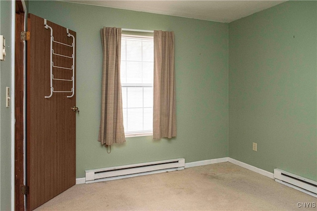 unfurnished room featuring light carpet and a baseboard radiator