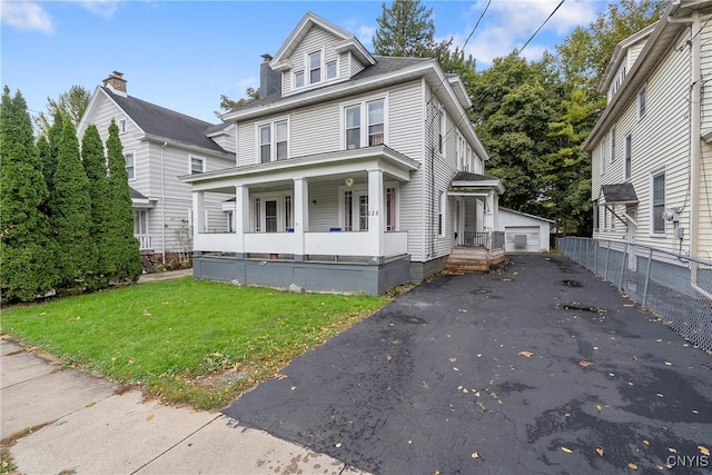 front facade with a front yard and a porch