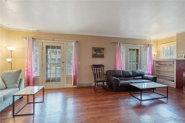 living room with ornamental molding and dark hardwood / wood-style flooring