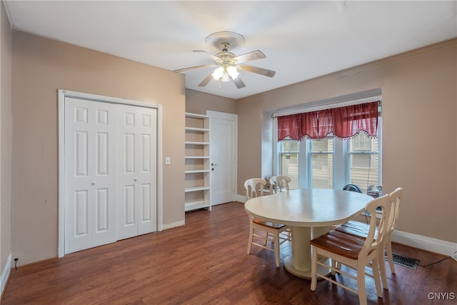 dining area with crown molding, ceiling fan, and dark hardwood / wood-style flooring