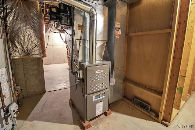 utility room featuring heating unit