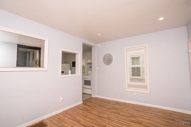 empty room featuring hardwood / wood-style flooring