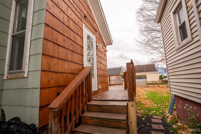 view of side of property featuring a wooden deck