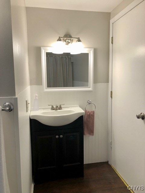 bathroom with vanity and wood-type flooring