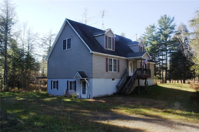 view of side of home with a lawn