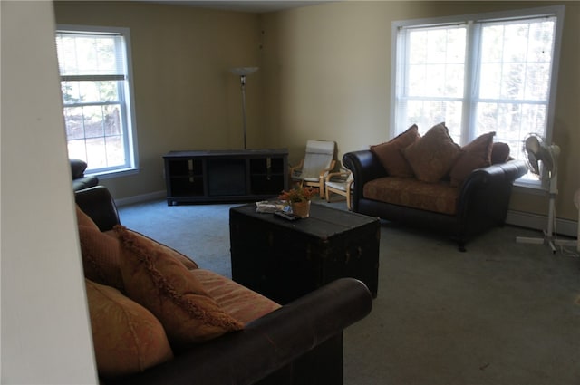 carpeted living room featuring plenty of natural light