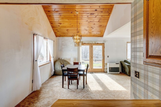 carpeted dining area with wooden ceiling, vaulted ceiling, and an inviting chandelier