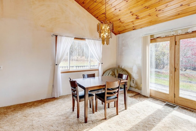 dining room with wooden ceiling, light colored carpet, vaulted ceiling, and a notable chandelier