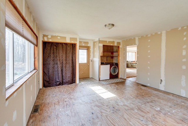 spare room featuring washer and dryer