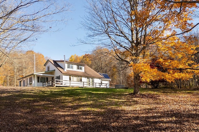 back of house with a yard