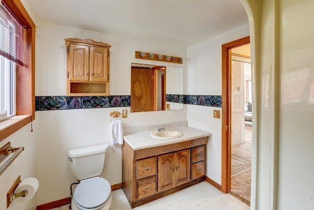 bathroom featuring toilet and vanity