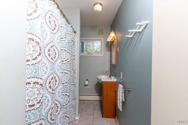 bathroom featuring vanity, a baseboard heating unit, a shower with curtain, and tile patterned flooring