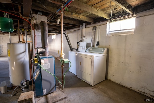 basement with washer and clothes dryer and gas water heater