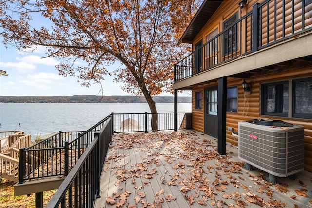 deck with a water view and central air condition unit