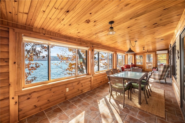 sunroom / solarium featuring vaulted ceiling, a water view, and wooden ceiling