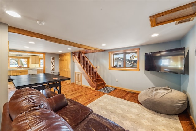 living room featuring light hardwood / wood-style flooring and sink