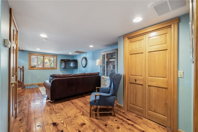 living room with light hardwood / wood-style floors