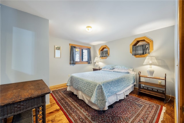 bedroom featuring hardwood / wood-style floors