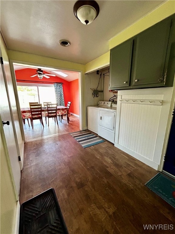 interior space with washer and clothes dryer, ceiling fan, and dark hardwood / wood-style floors