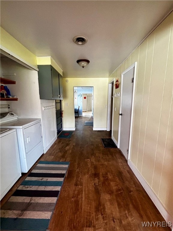 laundry room featuring dark wood-type flooring and independent washer and dryer