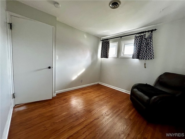 sitting room with hardwood / wood-style flooring