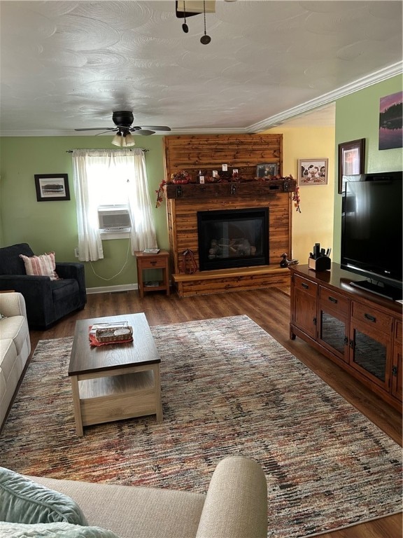 living room featuring dark wood-type flooring, ceiling fan, ornamental molding, and cooling unit