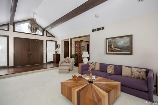 living room featuring light carpet and vaulted ceiling with beams