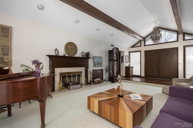 carpeted living room featuring beamed ceiling and high vaulted ceiling