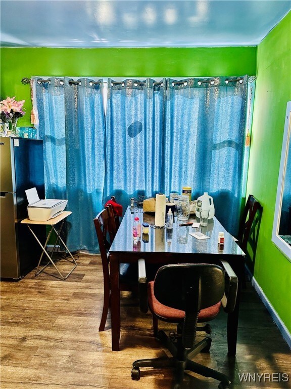 dining area with hardwood / wood-style flooring