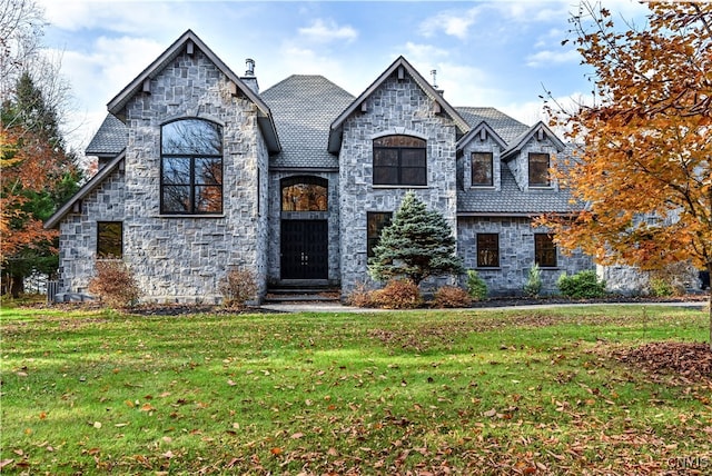 view of front of property with a front lawn