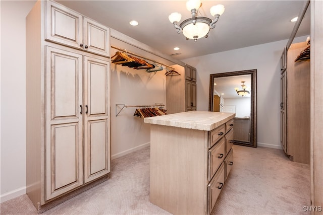 spacious closet with light carpet