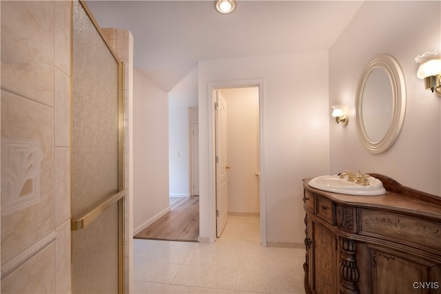 bathroom with vanity, tile patterned floors, and walk in shower