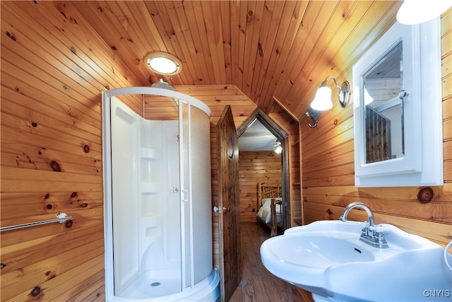 bathroom with wooden walls, wooden ceiling, and an enclosed shower