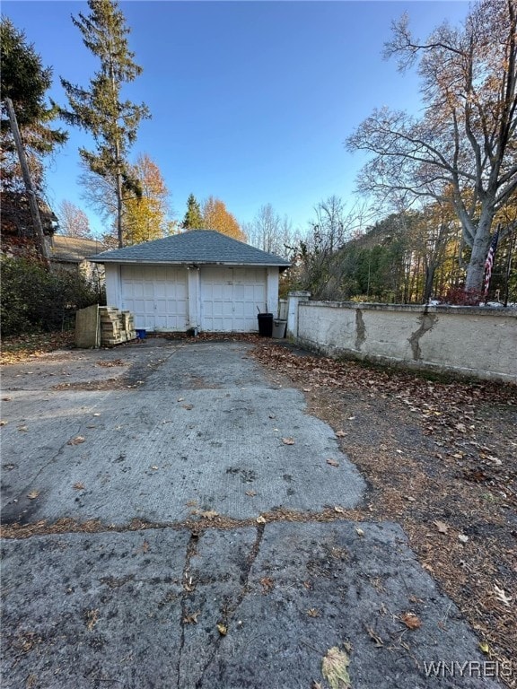 view of side of property featuring a garage