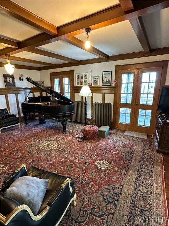 interior space with coffered ceiling, french doors, carpet flooring, and beamed ceiling