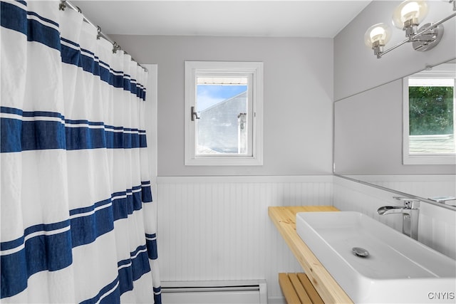 bathroom featuring a chandelier and sink