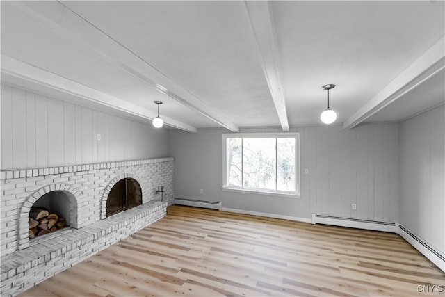 unfurnished living room with beamed ceiling, light wood-type flooring, a baseboard heating unit, and a fireplace