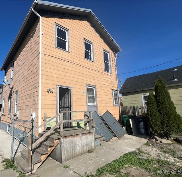 back of house with a wooden deck