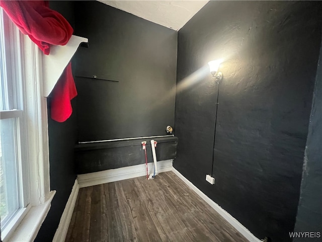 laundry room featuring wood-type flooring