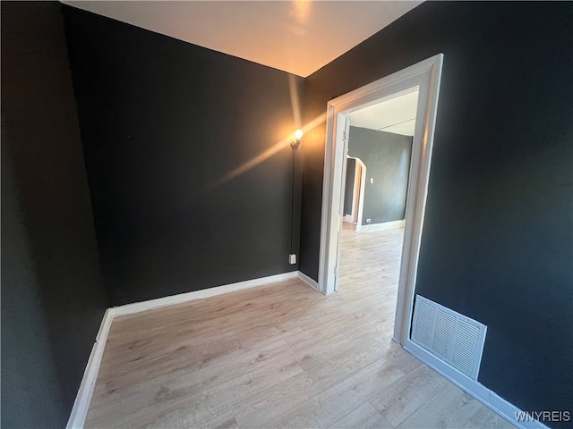 unfurnished room with light hardwood / wood-style flooring