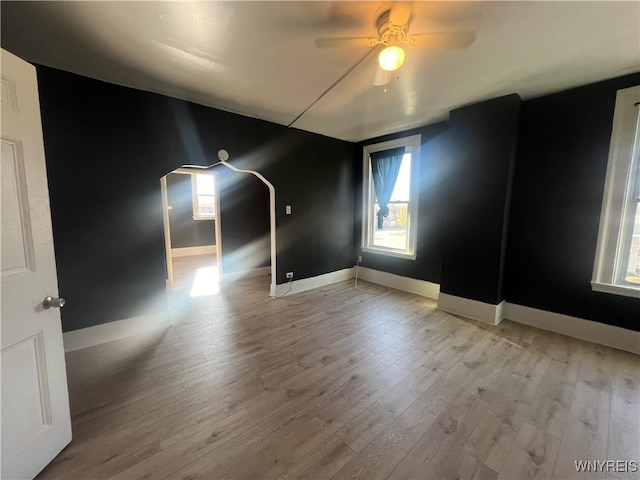 unfurnished room featuring light hardwood / wood-style flooring and ceiling fan