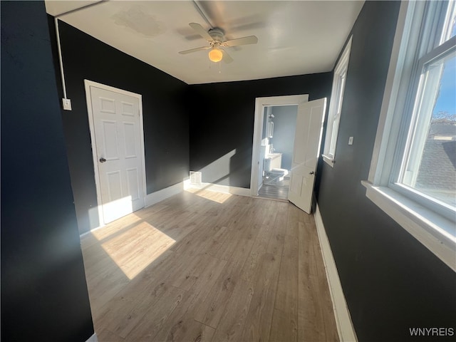 empty room featuring light hardwood / wood-style flooring and ceiling fan