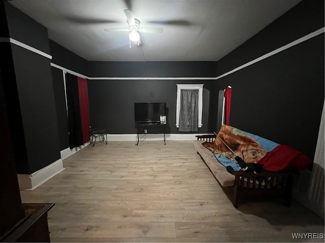 bedroom featuring hardwood / wood-style flooring and ceiling fan